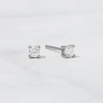 Sterling silver diamond cz stud earrings on white background