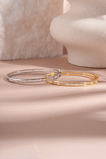Gold and sterling silver studded diamond bangle bracelet by Sami Jewels with a sleek, modern design and sparkling accents.