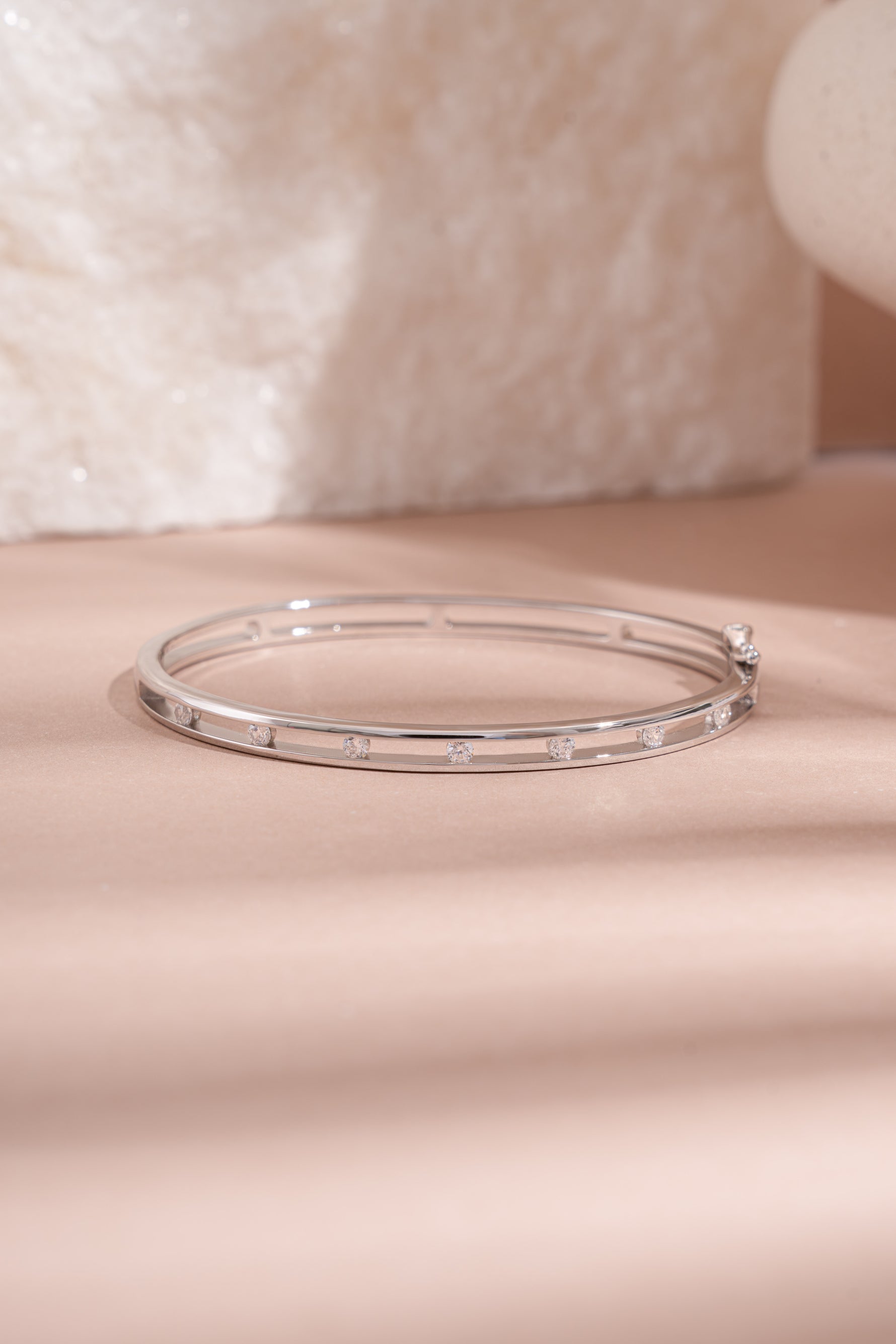 Sterling silver studded diamond bangle bracelet by Sami Jewels featuring sparkling gemstone accents and a sleek, modern design.
