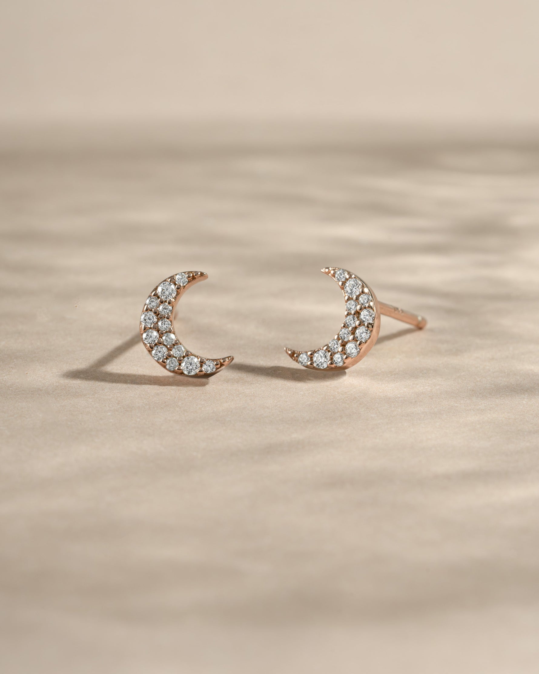 Rose gold studded moon earrings by Sami Jewels featuring small star accents and a sleek, minimalist design.