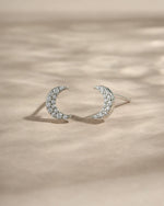 Sterling silver studded moon earrings by Sami Jewels featuring small, detailed moon designs with embedded studs.
