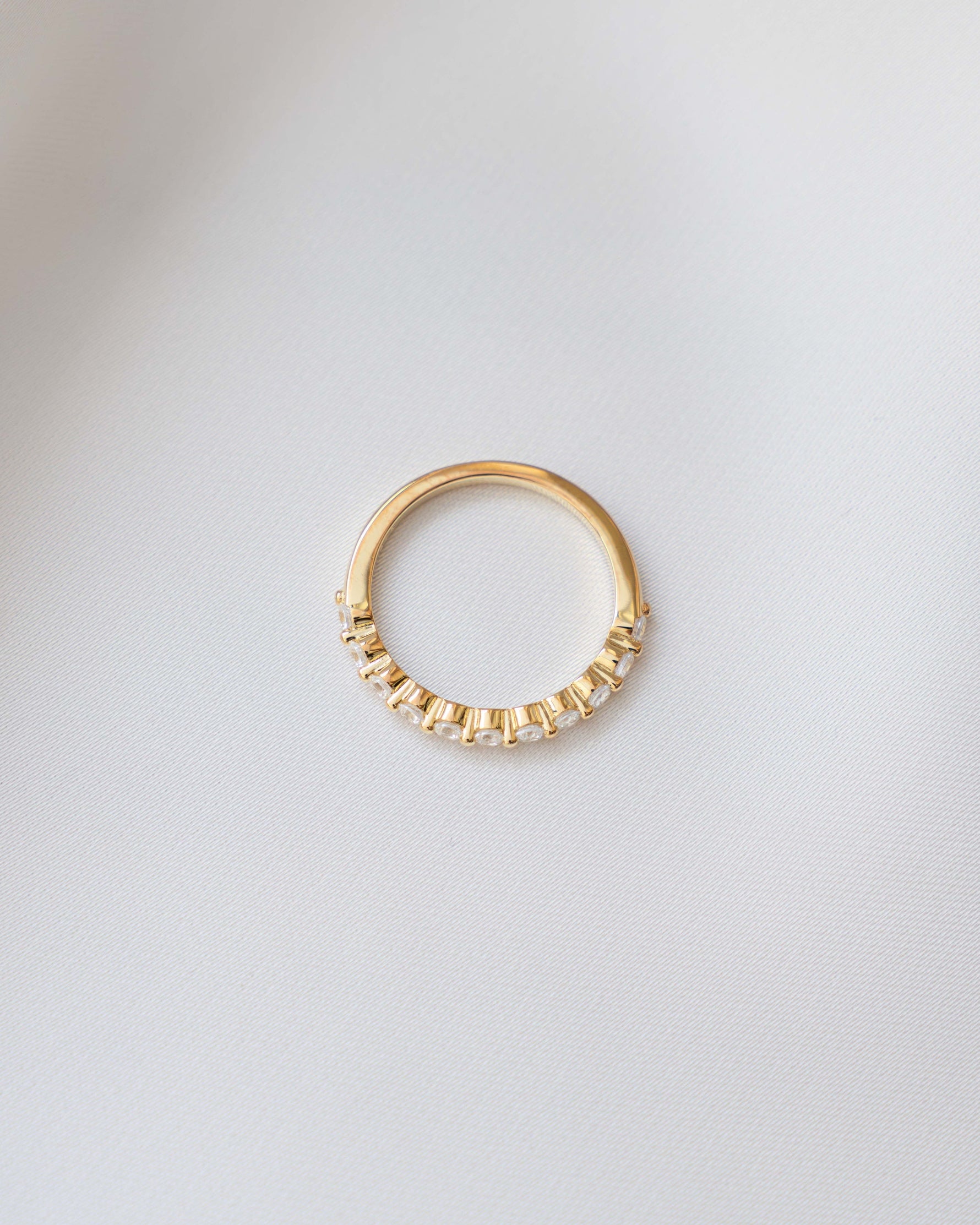 Gold studded stacking ring from Sami Jewels, featuring small diamond accents, viewed from the top showing its detailed design.