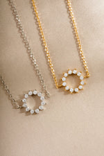 sunburst charm bracelets in gold and sterling silver closeup of stone detail