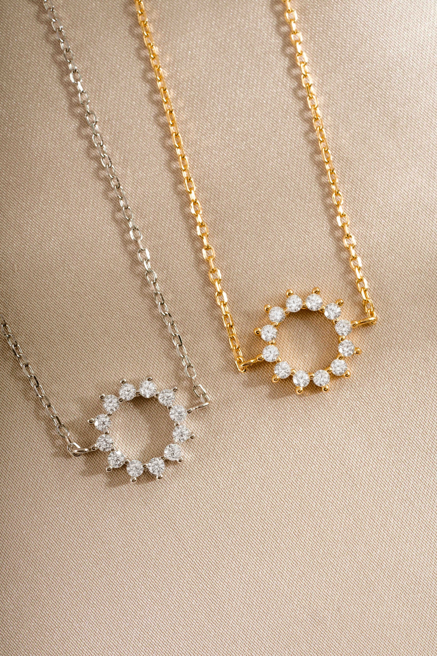 sunburst charm bracelets in gold and sterling silver closeup of stone detail