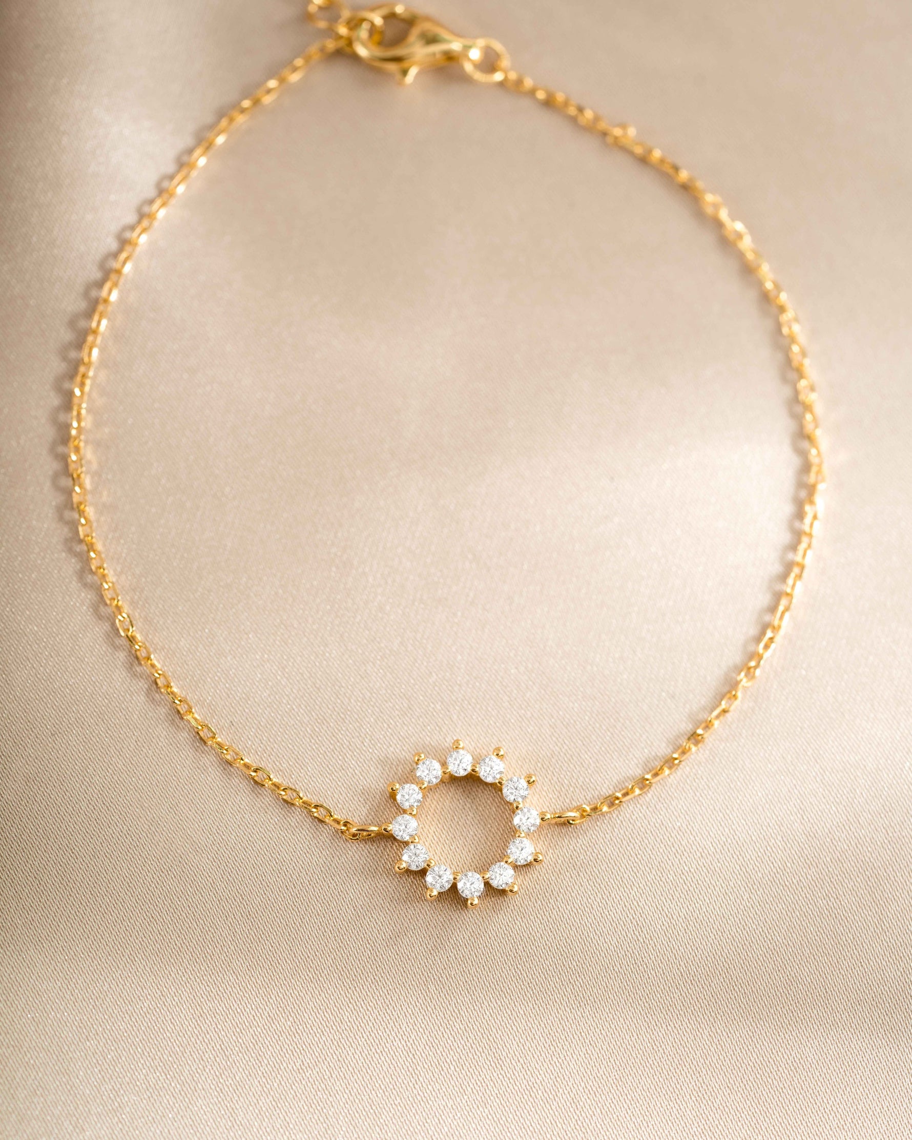 sunburst charm bracelet in gold closeup view