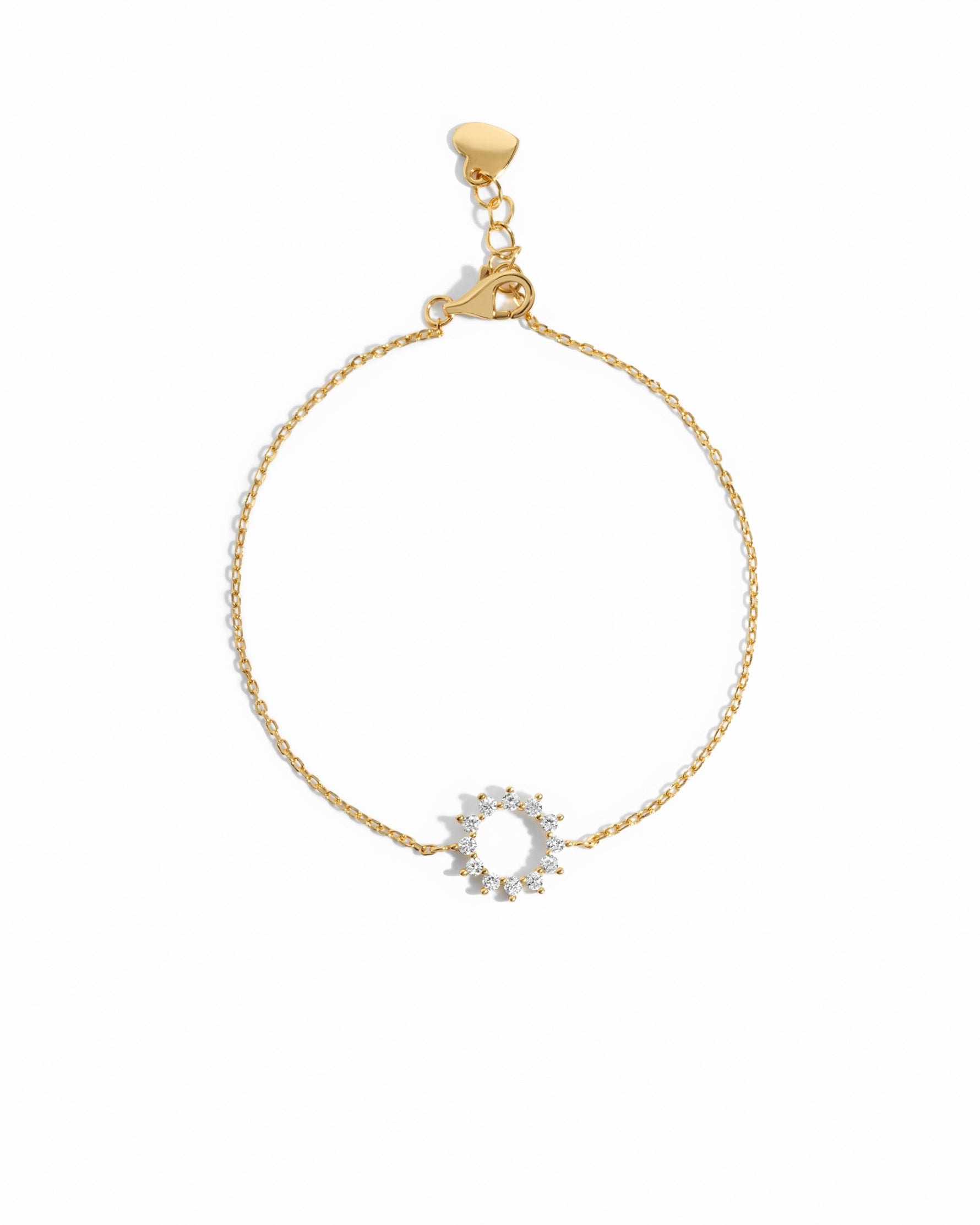 sunburst charm bracelet in gold on a white background 