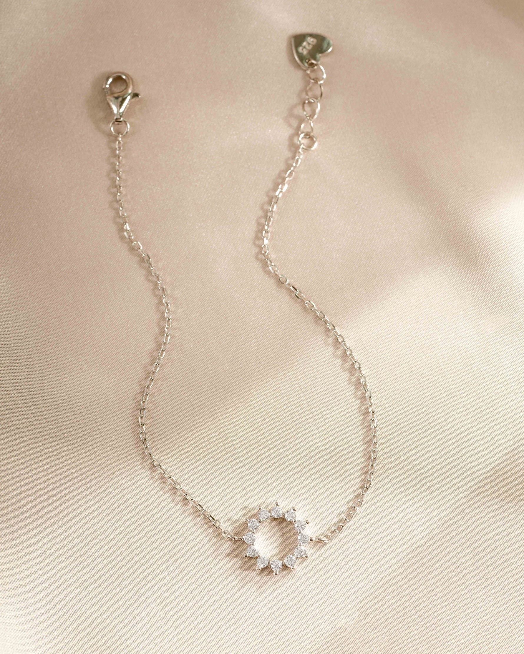 sunburst charm bracelet in sterling silver chain closeup