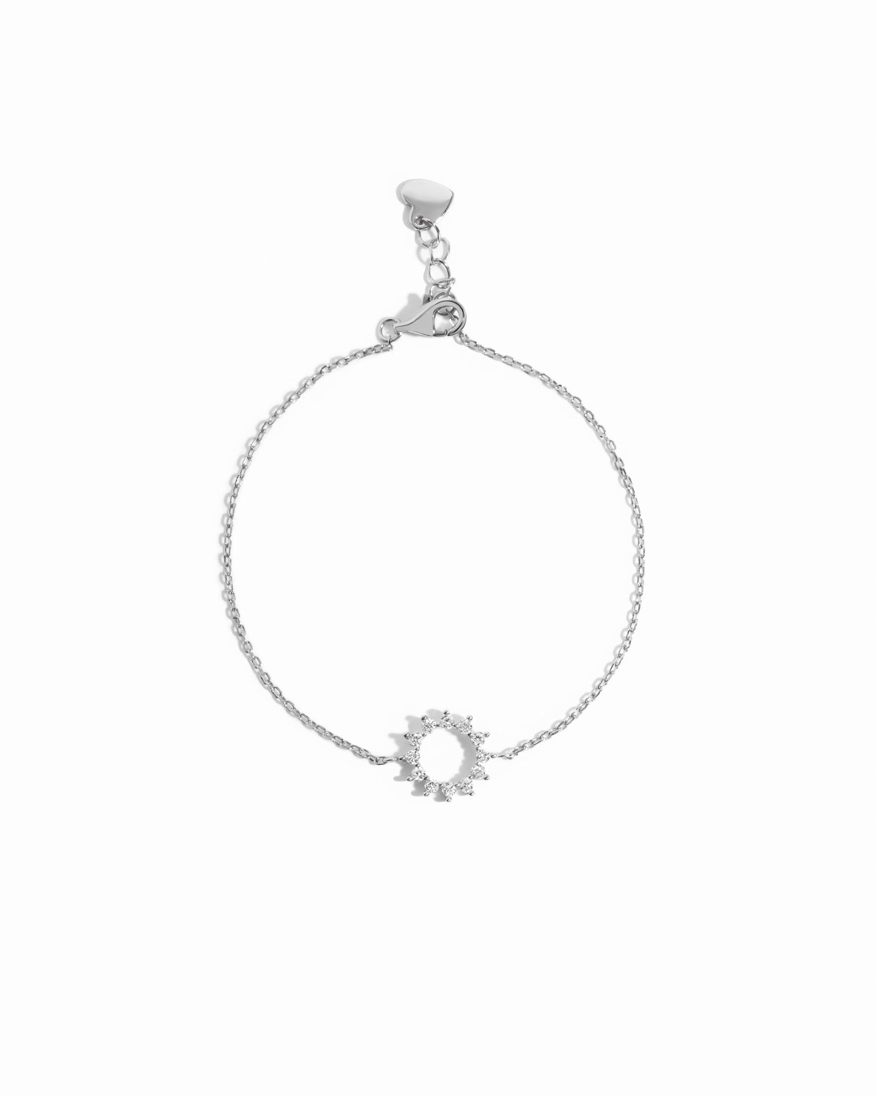 sunburst charm bracelet in sterling silver on a white background