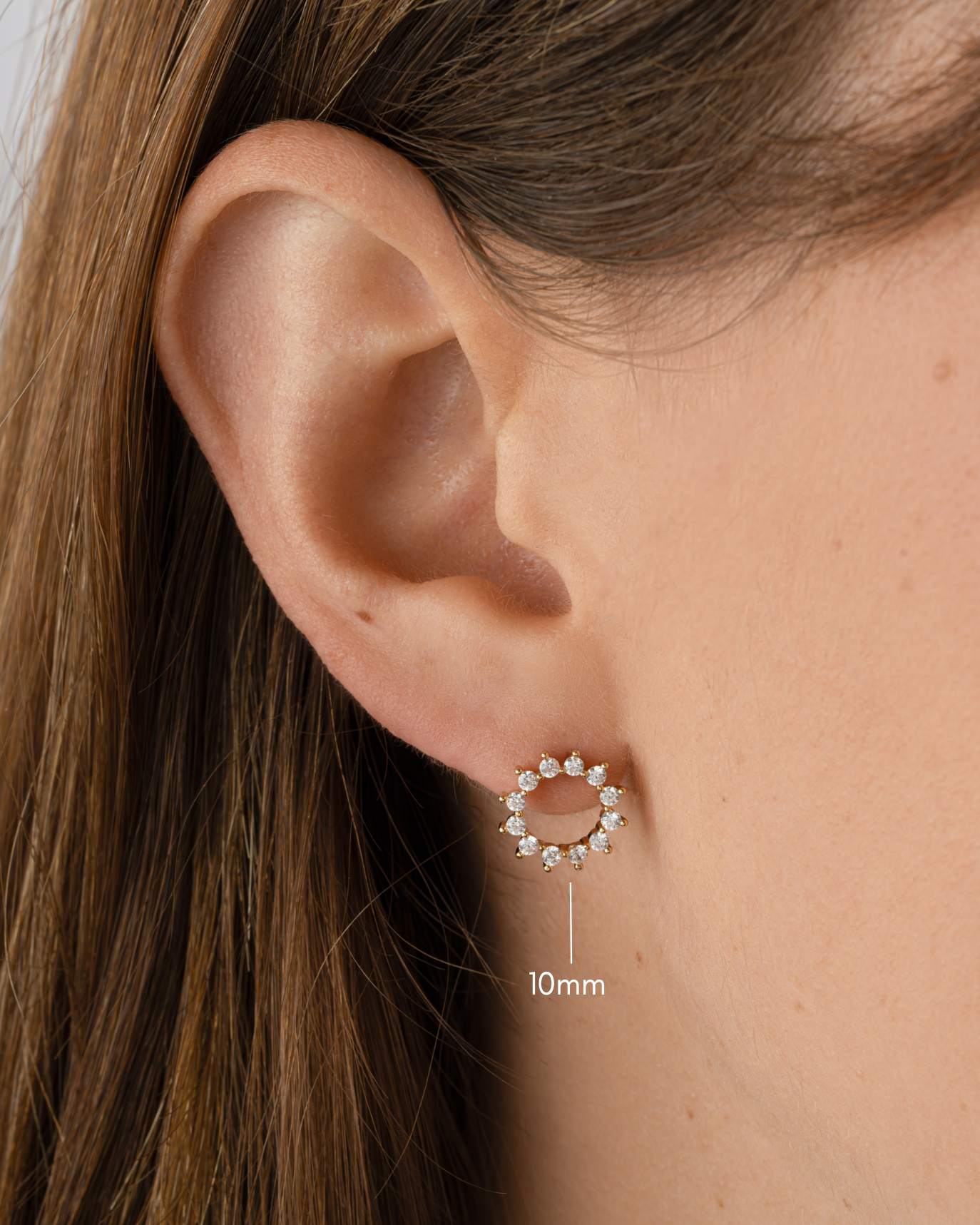 Gold 10mm Sunburst Stud Earrings by Sami Jewels featuring sparkling diamond accents on a sleek stud design.