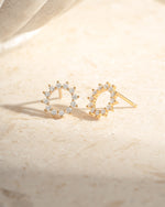 Gold 10mm Sunburst Stud Earrings by Sami Jewels featuring sparkling diamond accents on a sleek design.