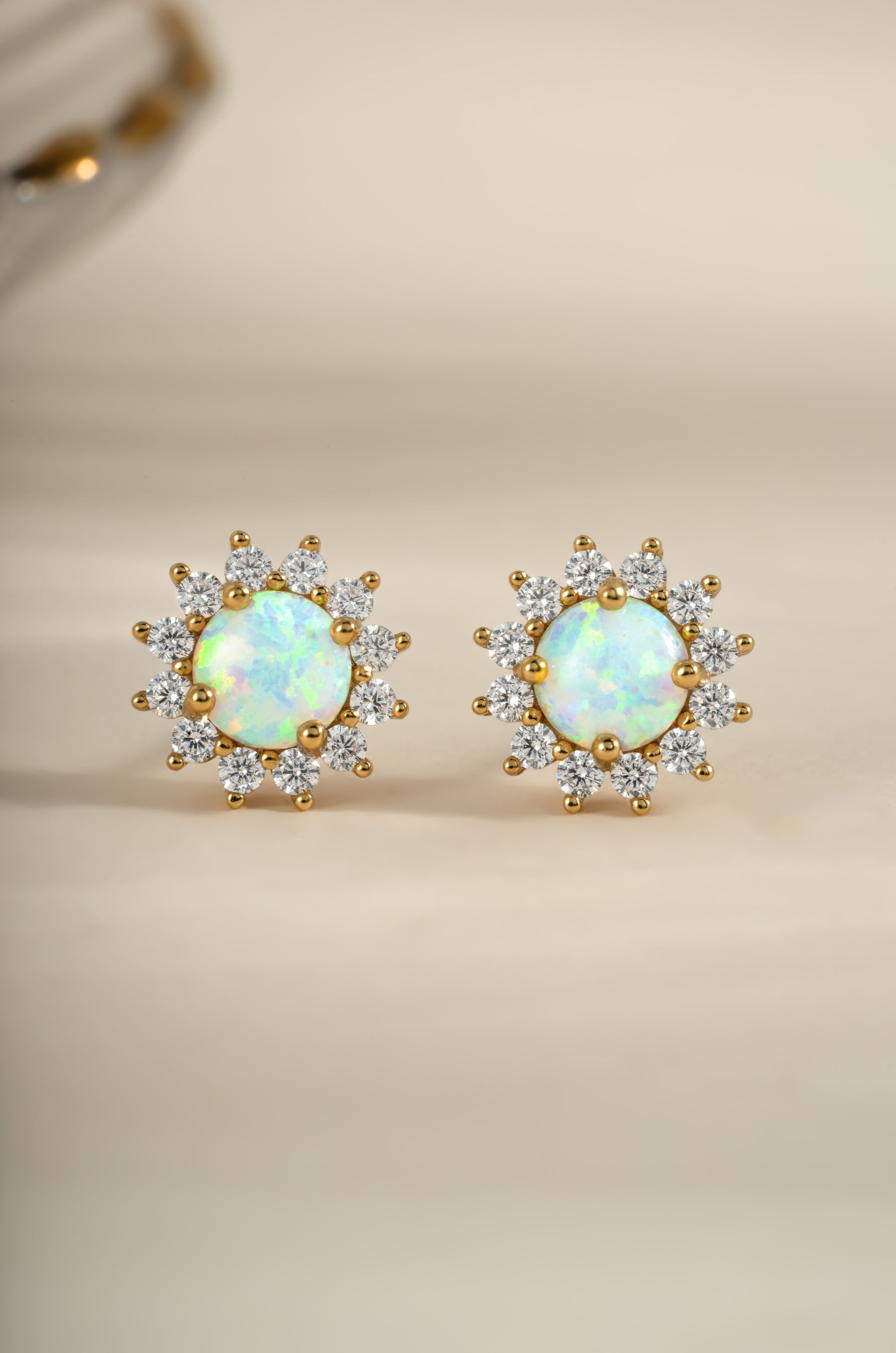 Gold Sunburst Opal Halo Stud Earrings by Sami Jewels, front view showcasing sparkling opal centers and intricate halo design.