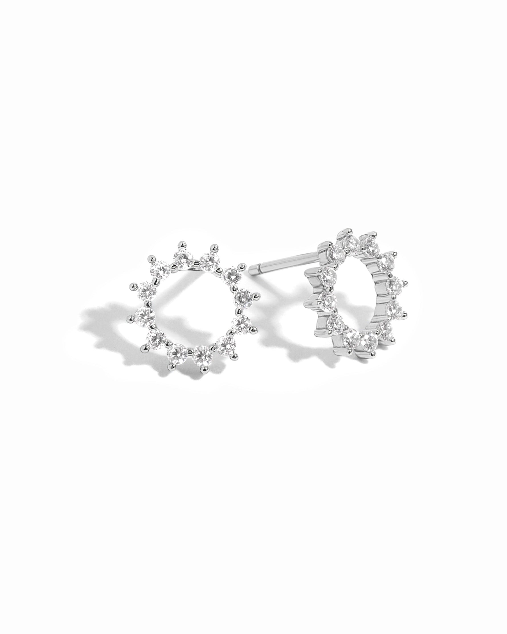Sterling silver 10mm Sunburst Stud Earrings by Sami Jewels with a shiny, detailed sunburst design on a white background.
