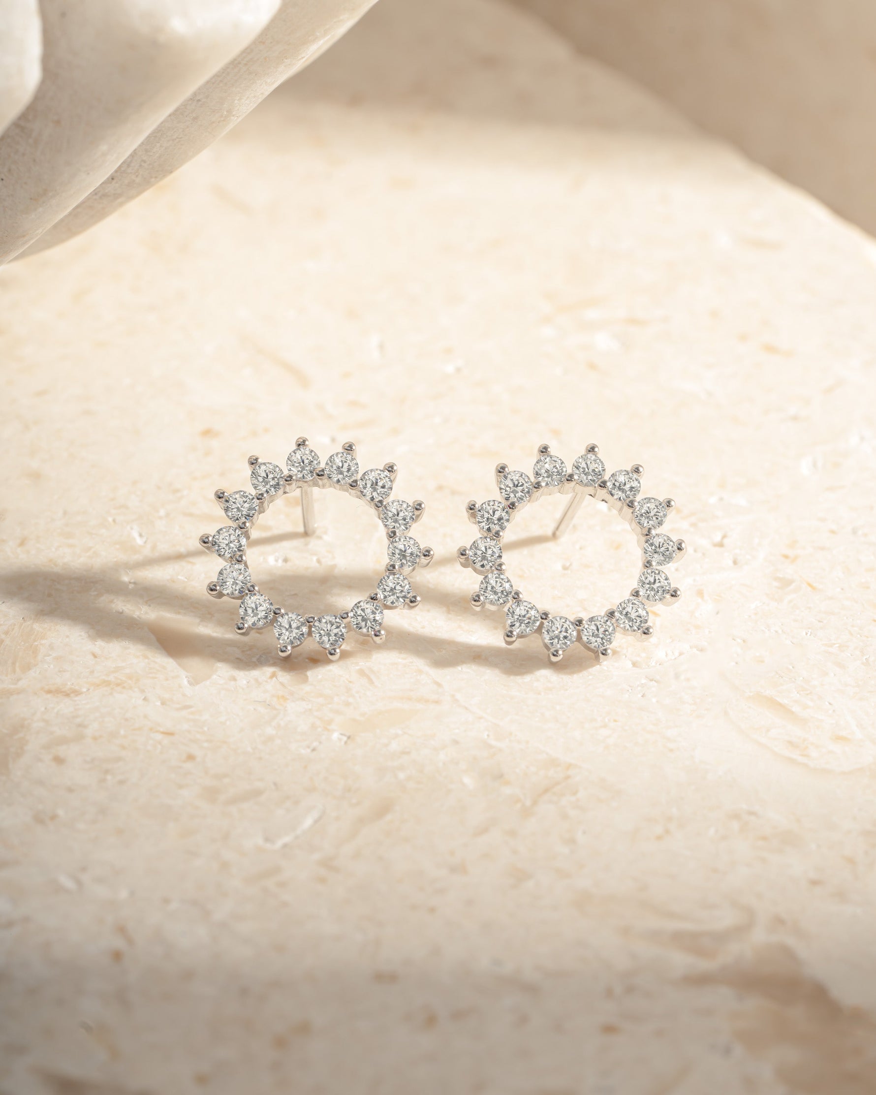 Sterling silver 15mm Sunburst Stud Earrings by Sami Jewels featuring a detailed sunburst design on each earring.