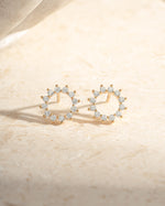Gold 10mm Sunburst Stud Earrings by Sami Jewels featuring a radiant sunburst design on each earring.