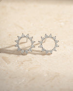 Sterling silver 10mm Sunburst Stud Earrings by Sami Jewels, front view showcasing radiant sunburst design.