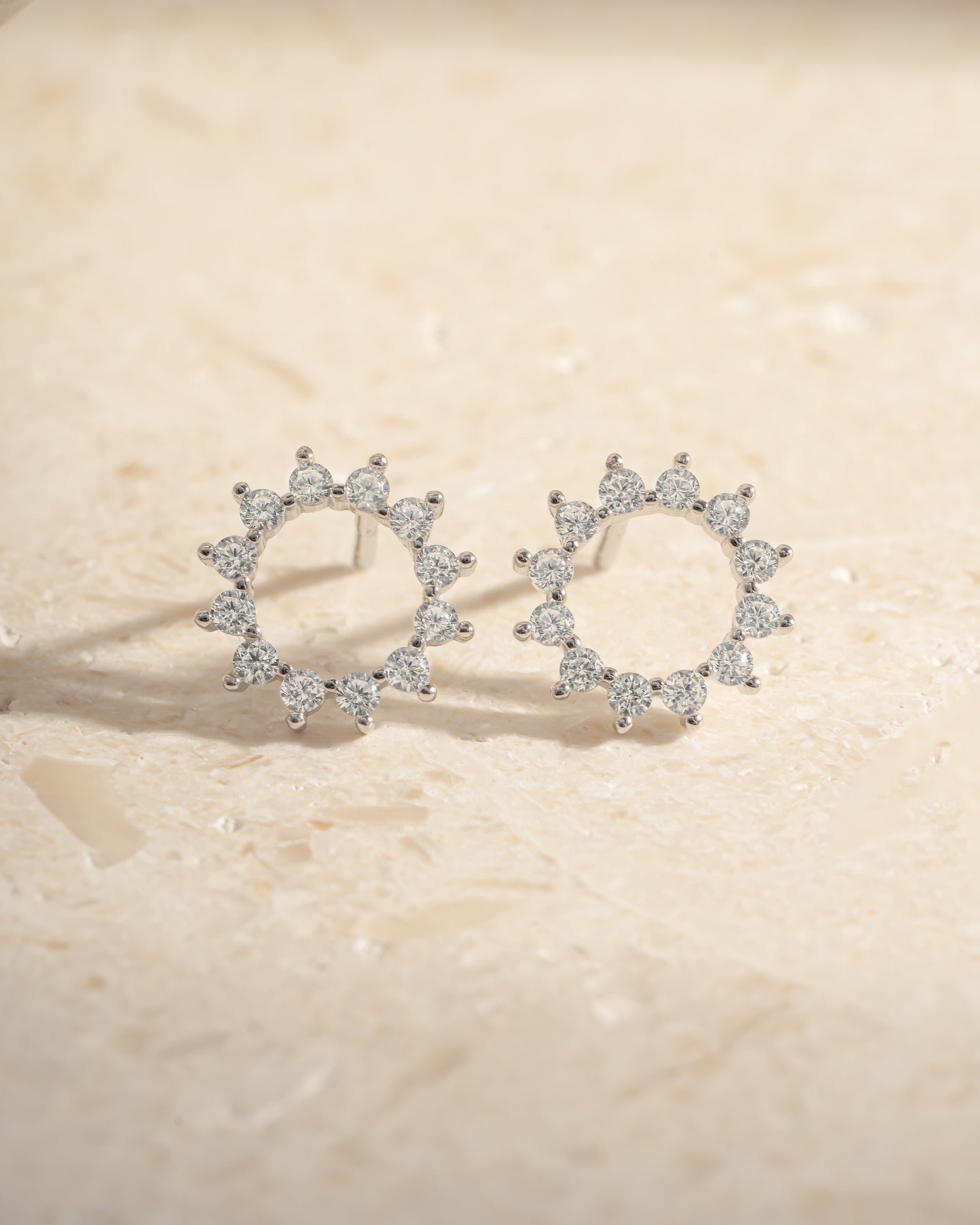Sterling silver 10mm Sunburst Stud Earrings by Sami Jewels, front view showcasing radiant sunburst design.