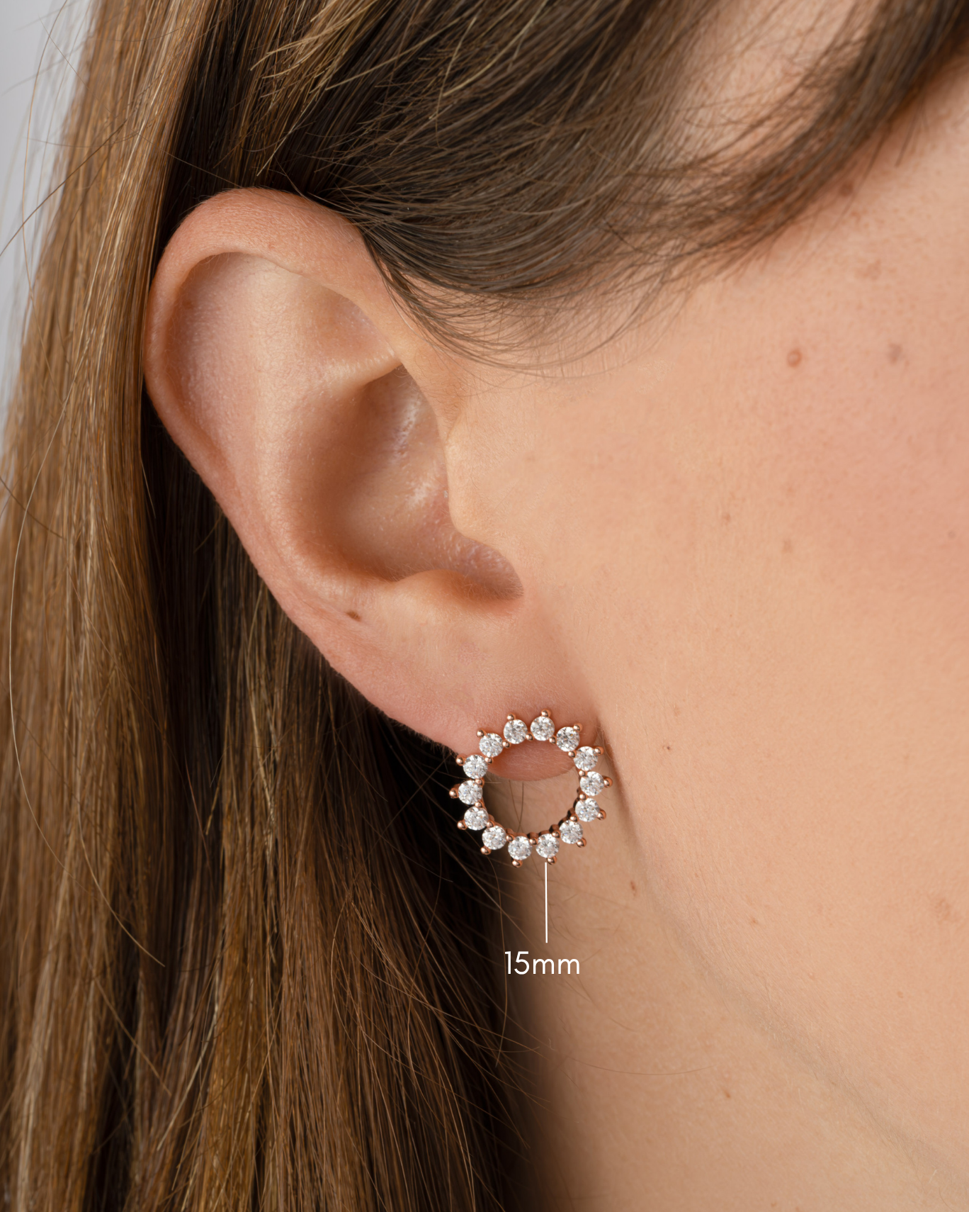 sunburst stud earrings in gold in 15mm on model