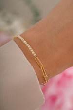 Gold tennis and paperclip bracelet by Sami Jewels featuring sleek, modern design with interconnected links.