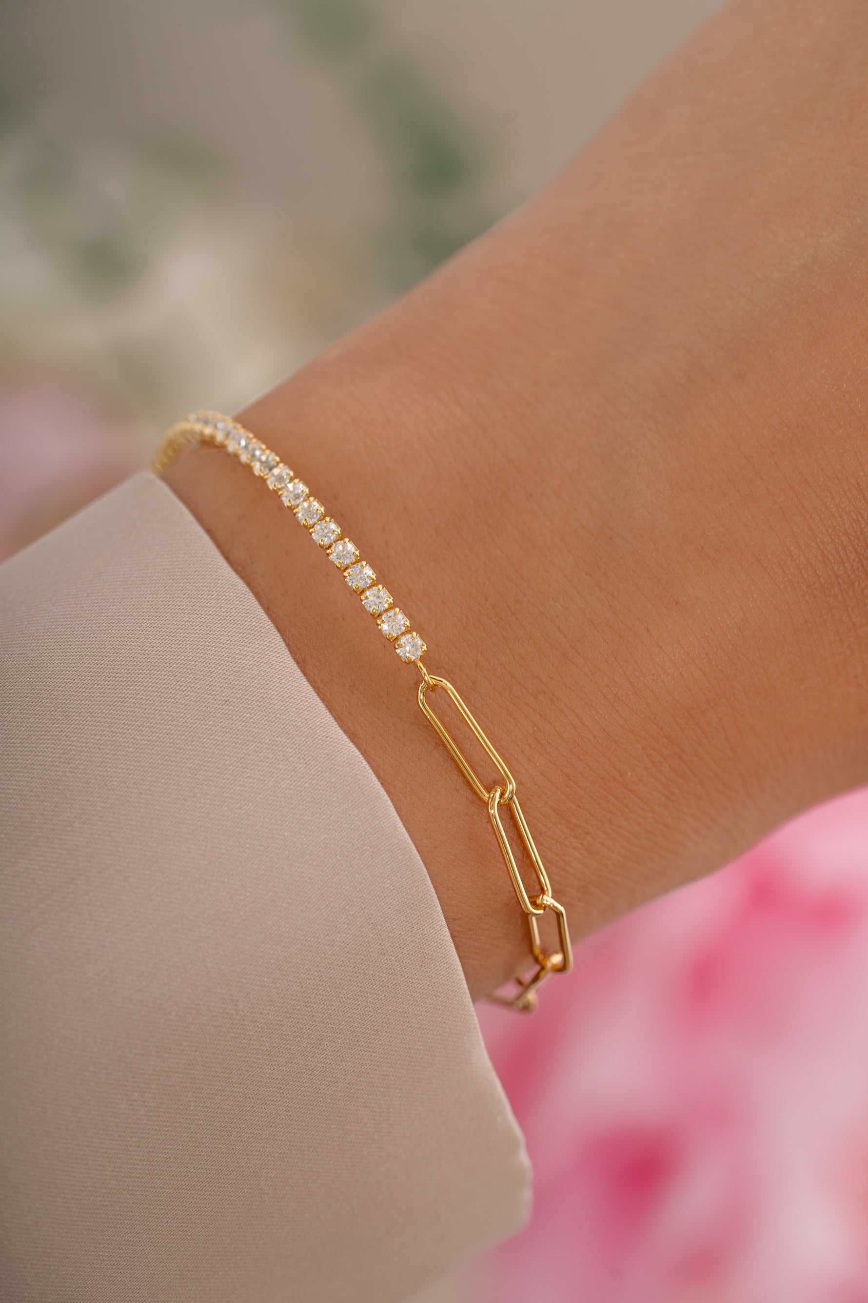 Gold tennis and paperclip bracelet by Sami Jewels featuring sleek, modern design with interconnected links.