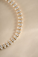 Close-up of Sami Jewels Marquise Tennis Bracelet featuring marquise-cut stones set in gold.