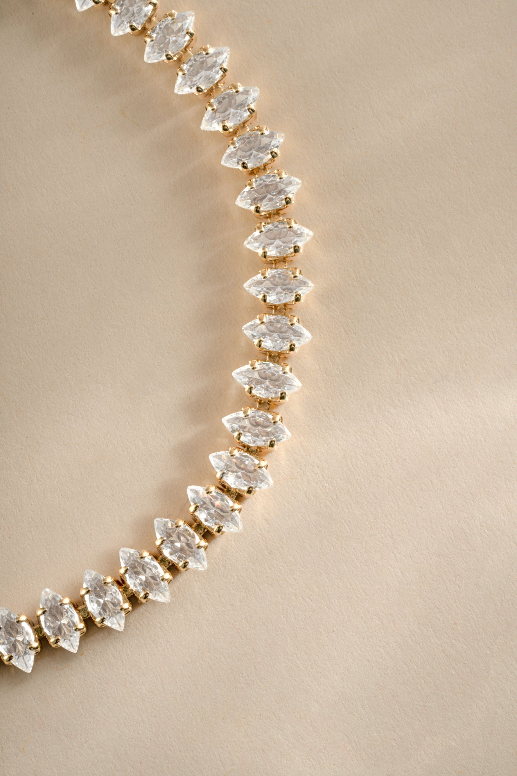 Close-up of Sami Jewels Marquise Tennis Bracelet featuring marquise-cut stones set in gold.