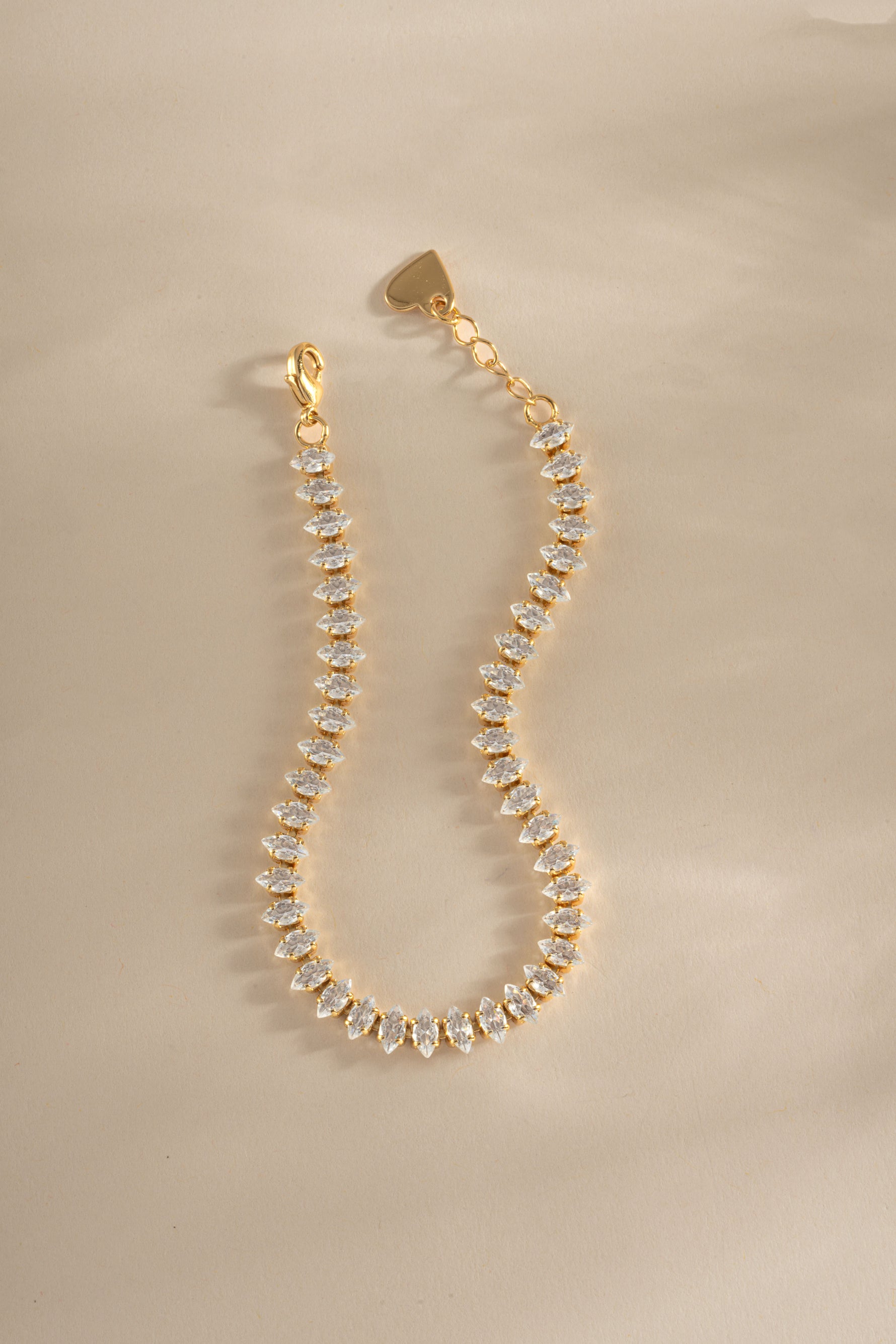 Gold Sami Jewels Marquise Tennis Bracelet with sparkling stones and extension chain for a stylish and elegant look.