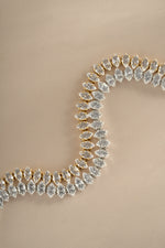 Sami Jewels Marquise Tennis Bracelet featuring marquise-cut stones in silver and gold, elegant and sparkling jewelry accessory.