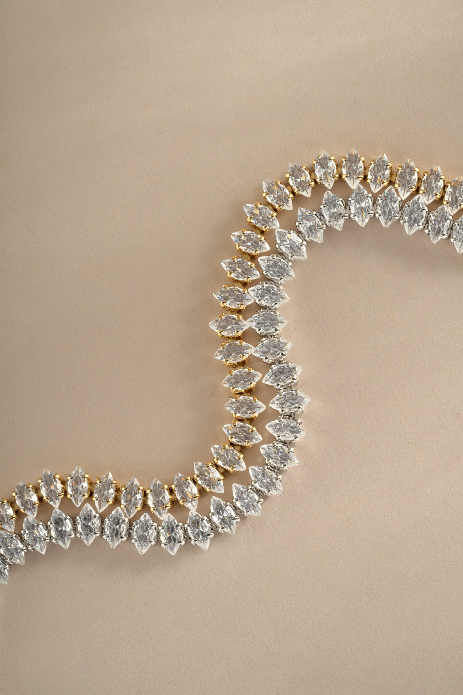 Sami Jewels Marquise Tennis Bracelet featuring marquise-cut stones in silver and gold, elegant and sparkling jewelry accessory.
