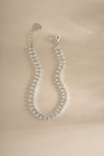 Close-up of Sami Jewels marquise tennis bracelet featuring sparkling marquise stones set in silver.