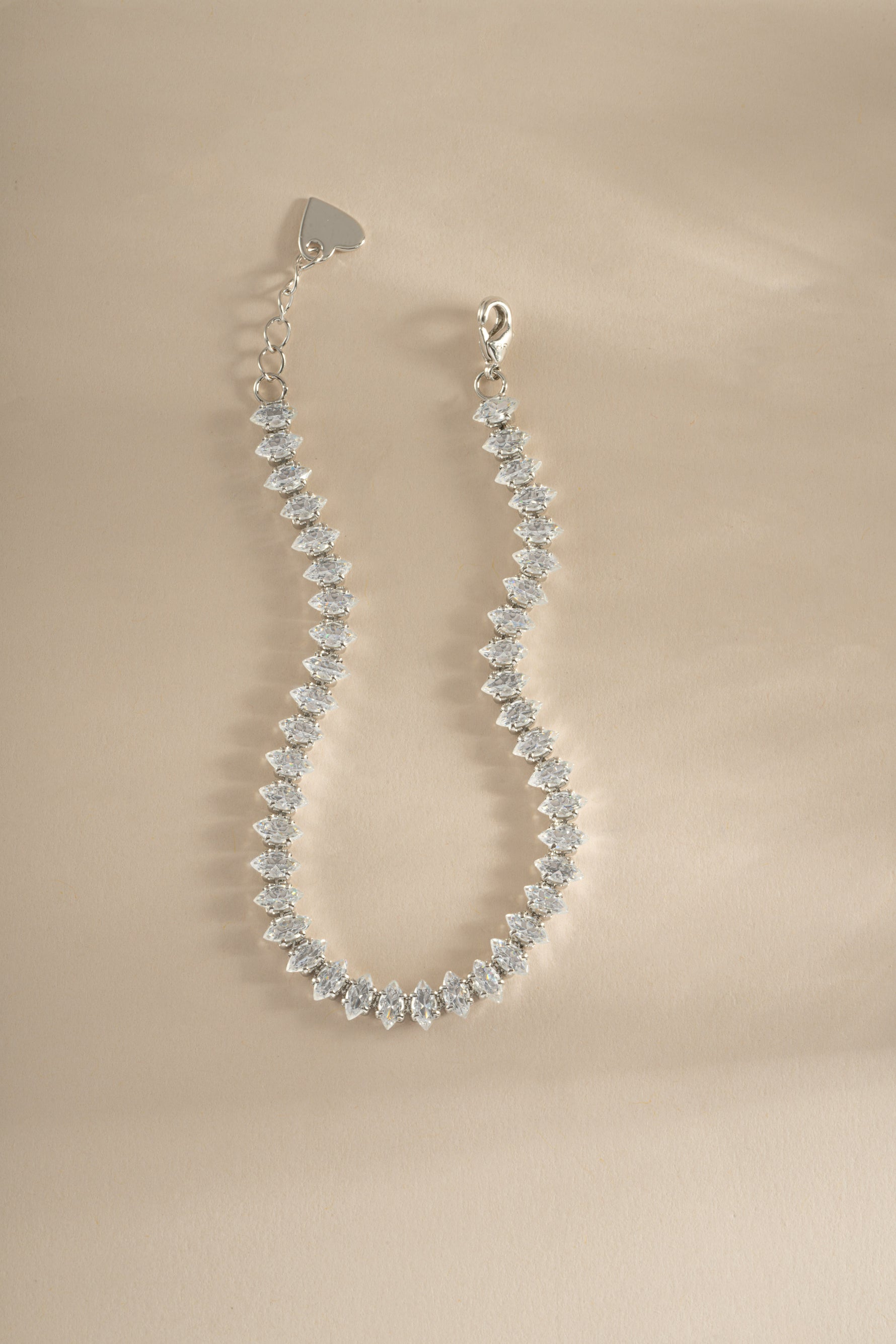 Close-up of Sami Jewels marquise tennis bracelet featuring sparkling marquise stones set in silver.