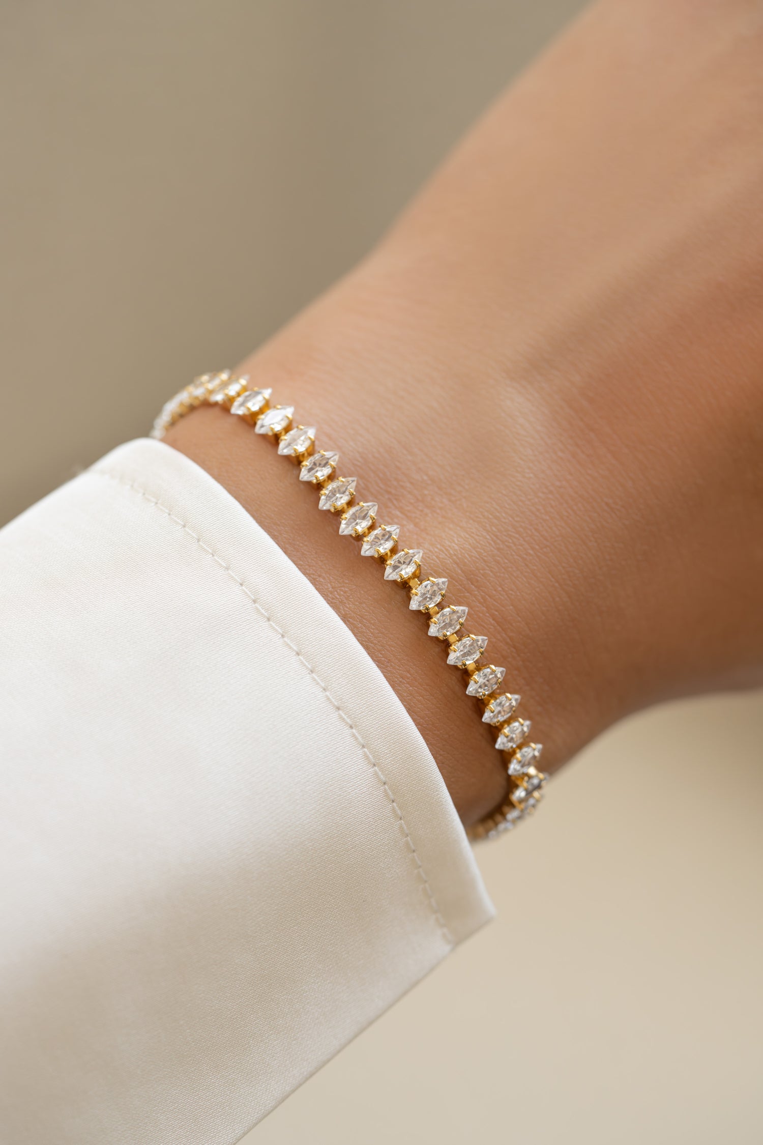 Silver Sami Jewels Marquise Tennis Bracelet with sparkling marquise stones worn on a model's wrist.