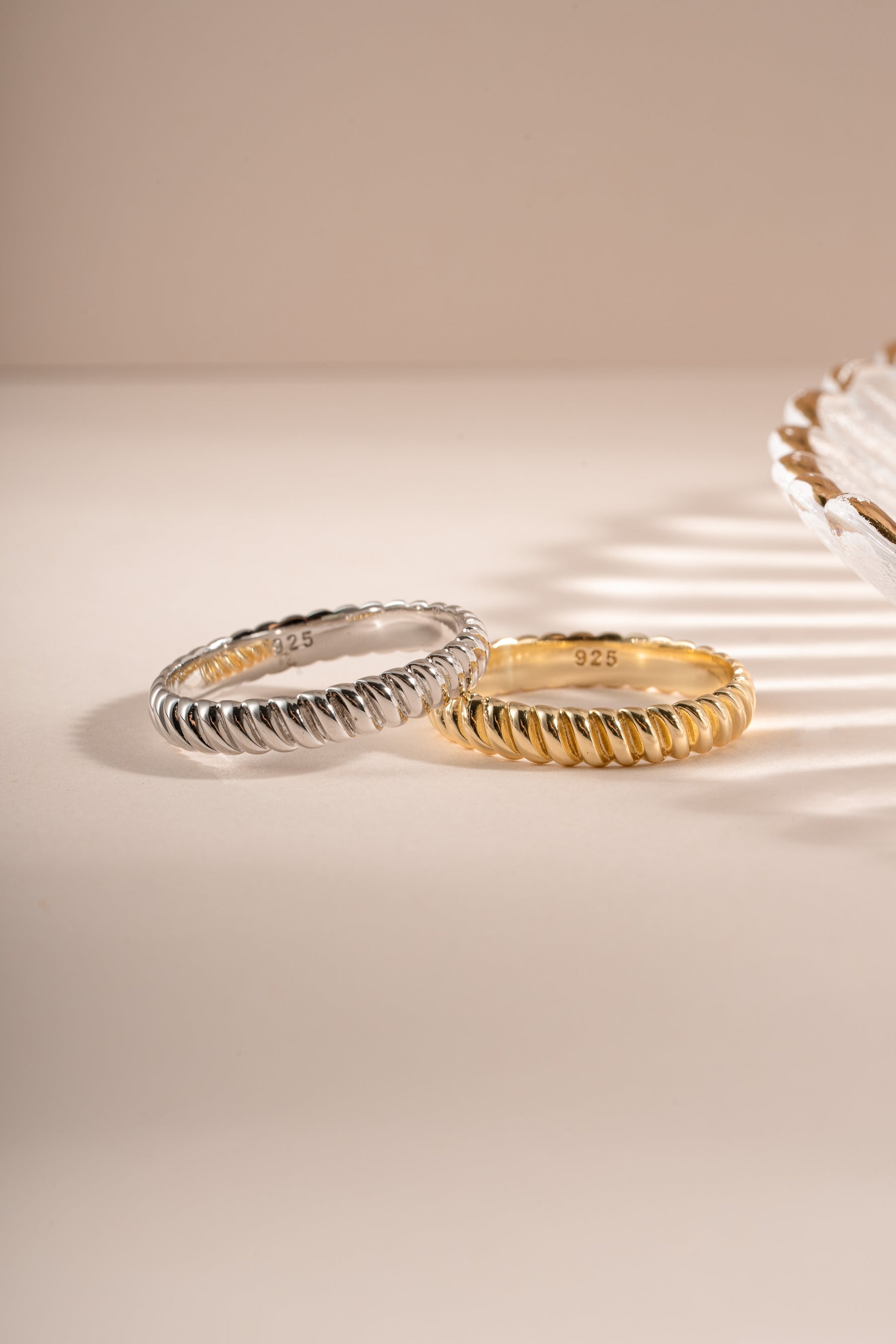 Close-up of Sami Jewels textured stacking ring in gold and sterling silver, showcasing its detailed design and finish.
