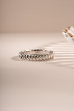 Sterling silver textured stacking ring from Sami Jewels with a detailed, modern design, shown from a front view.