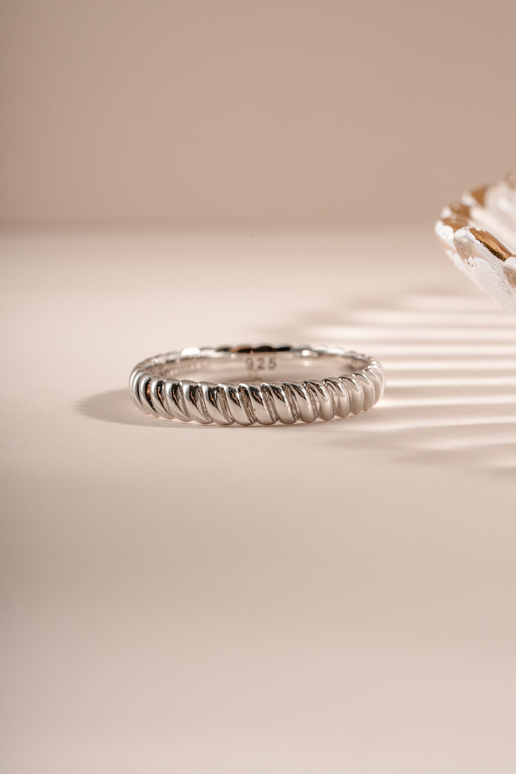 Sterling silver textured stacking ring from Sami Jewels with a detailed, modern design, shown from a front view.