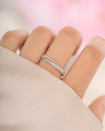 Sterling silver textured stacking ring from Sami Jewels, showcasing a detailed, hammered finish on a sleek, modern ring design.