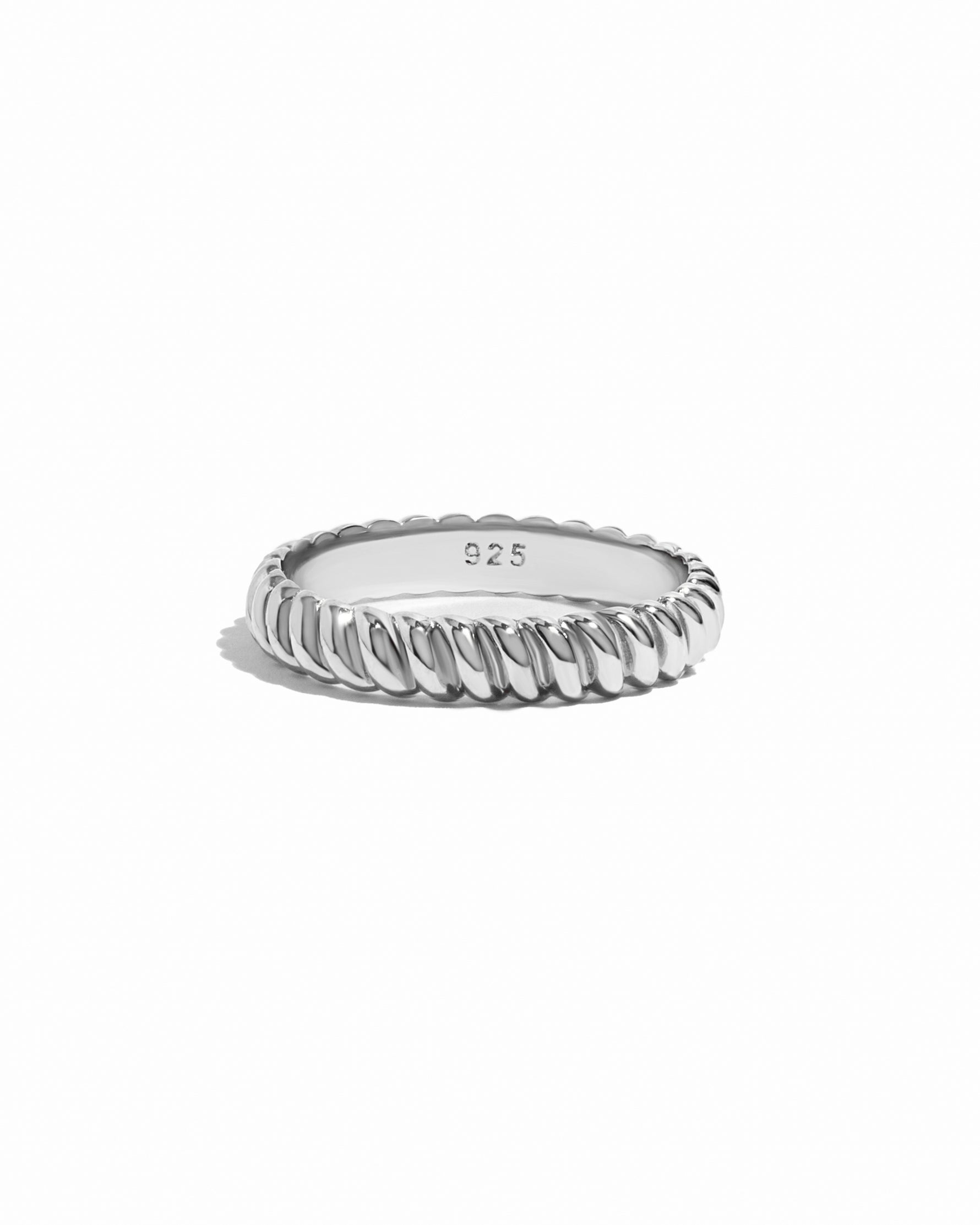 Sterling silver textured stacking ring by Sami Jewels, featuring a detailed, layered design on a white background.