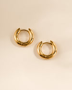 Gold stainless steel SS hoops earrings by Sami Jewels, thick huggie design with a waterproof finish.