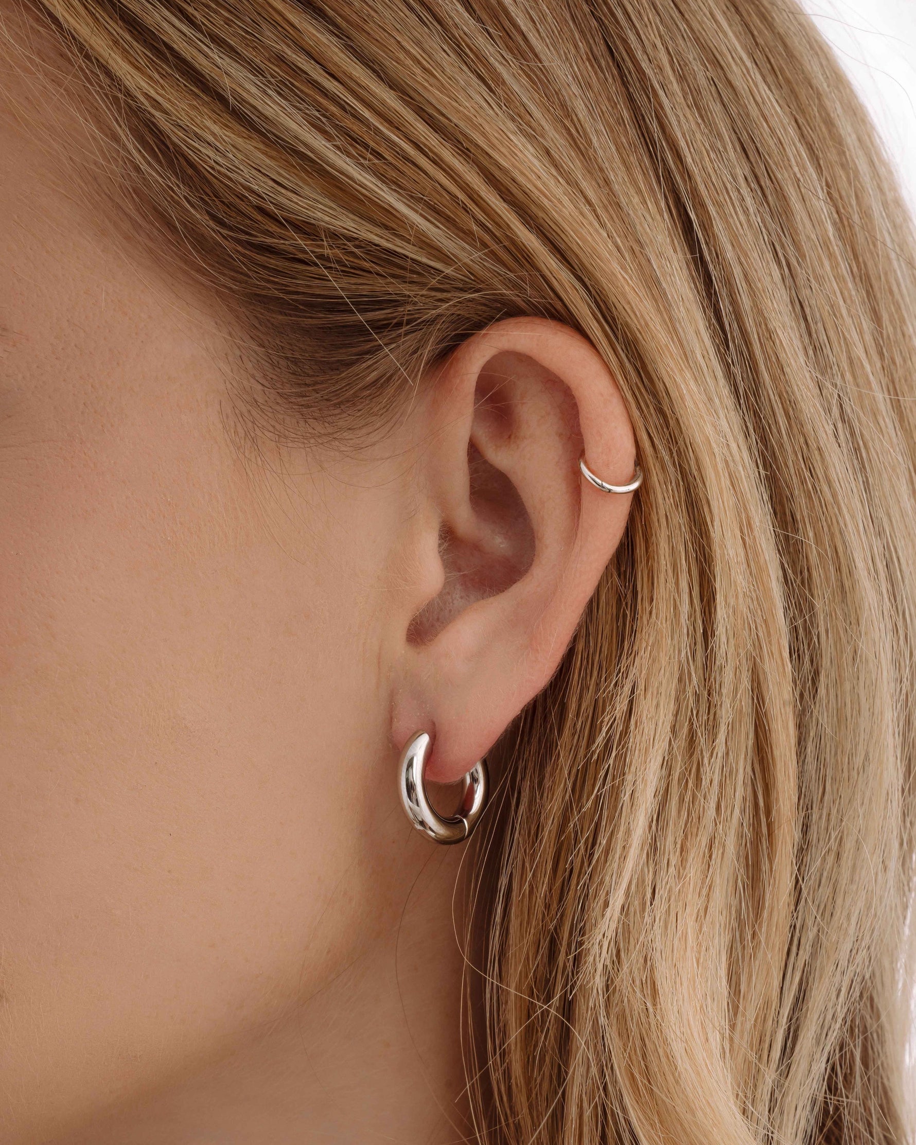 Silver stainless steel SS hoops earrings by Sami Jewels, thick huggie design, waterproof and stylish for everyday wear.