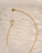 Gold thin chain necklace from Sami Jewels with a lobster clasp, showcasing a delicate and elegant jewelry piece.