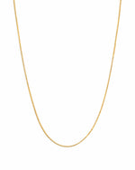 Gold thin chain necklace from Sami Jewels on a white background, showcasing its delicate and elegant design.