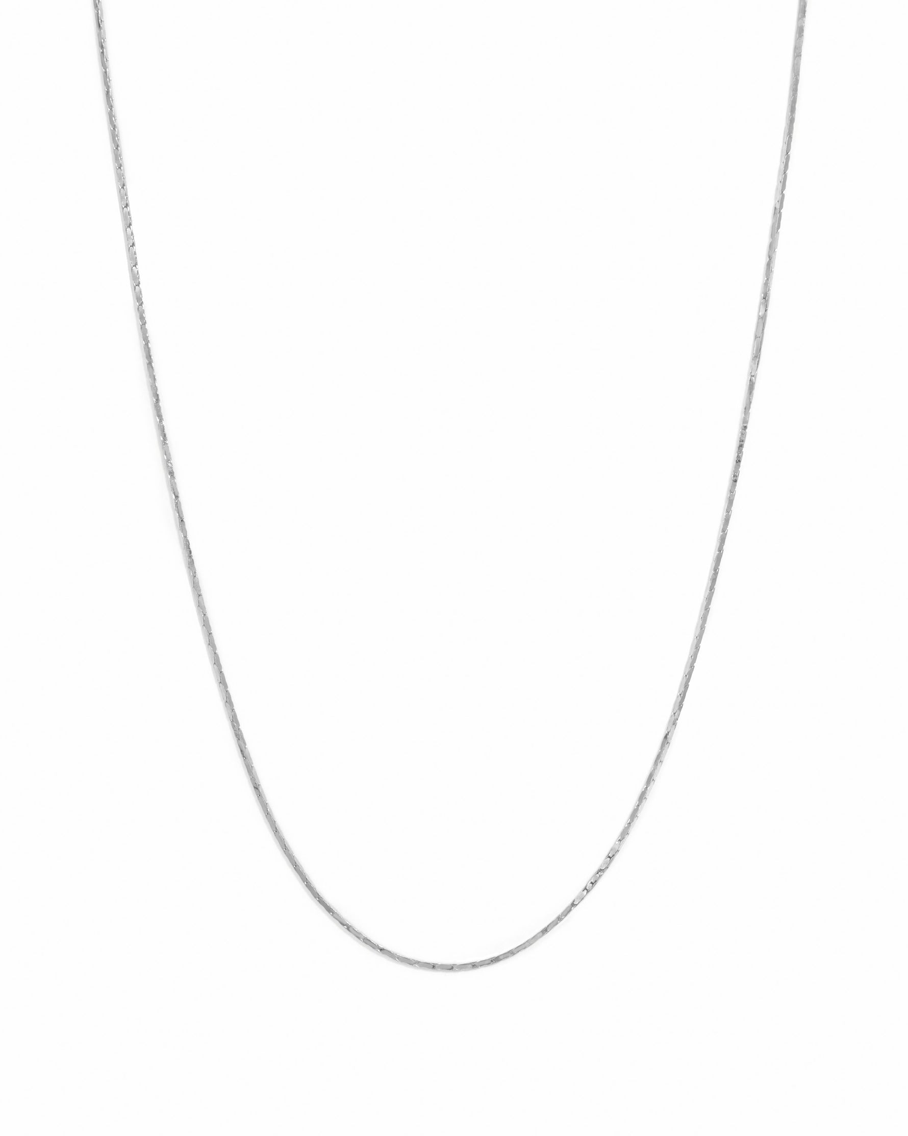 Sterling silver thin chain necklace from Sami Jewels displayed on a white background, showcasing its delicate and elegant design.