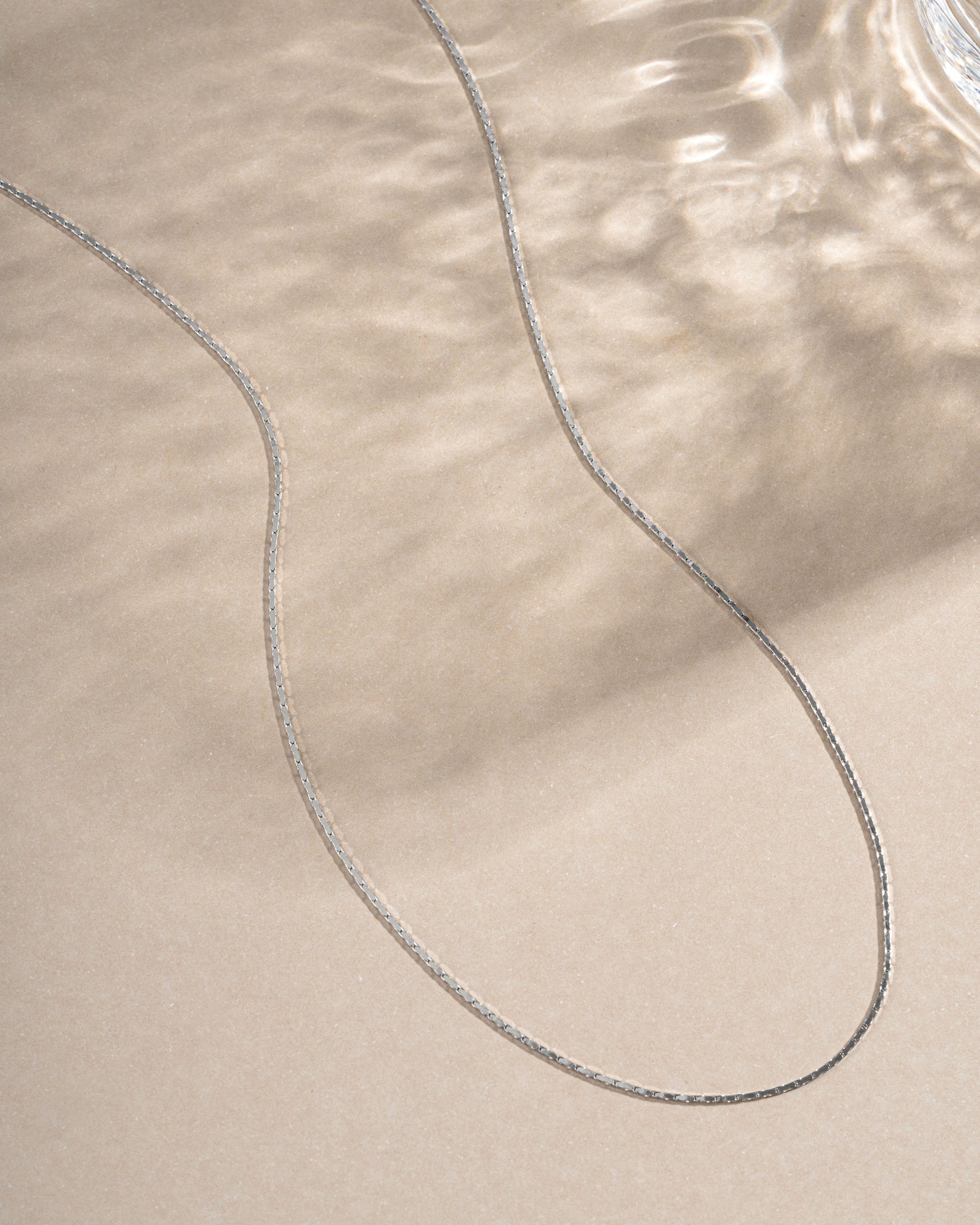 Sterling silver thin chain necklace from Sami Jewels featuring a delicate, minimalist design for everyday wear.
