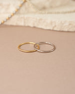 Gold and sterling silver thin plain band ring from Sami Jewels, showcasing a sleek and simple jewelry design.