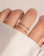 Thin plain band ring by Sami Jewels, featuring a sleek gold and sterling silver design, showcased on a neutral background.