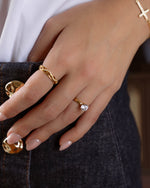 Gold Thin Plain Band Ring by Sami Jewels worn on a model, showcasing a sleek, minimalist design in a close-up shot.
