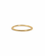 Gold thin plain band ring from Sami Jewels, close-up of simple, elegant jewelry on a white background.