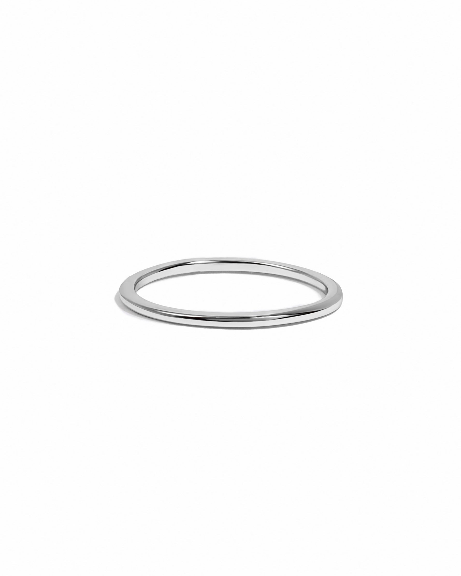Sterling silver thin plain band ring by Sami Jewels, simple and elegant jewelry piece on a white background