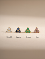 Tiny Emerald 3 Stone Stud Earrings by Sami Jewels featuring gold setting and three sparkling emerald stones.