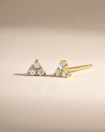 Gold Tiny CZ 3 Stone Stud Earrings by Sami Jewels featuring sparkling cubic zirconia stones in a three-stone setting.