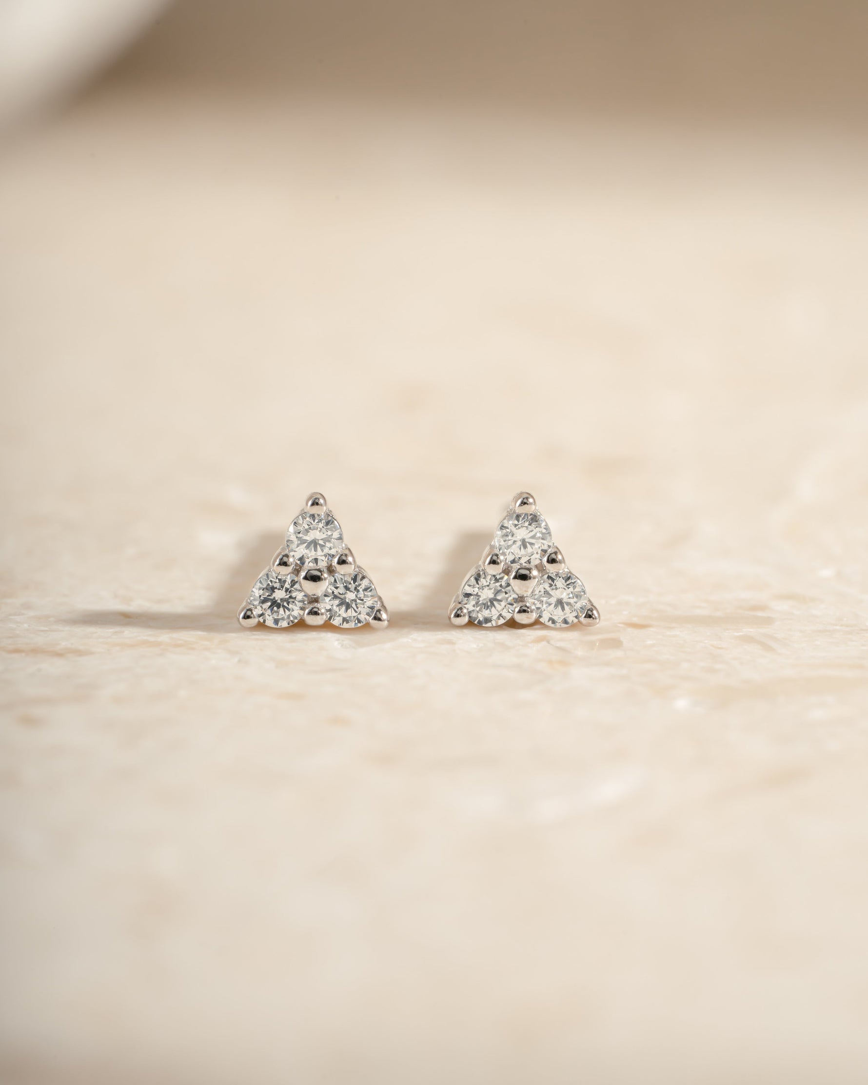 Sterling silver Tiny CZ 3 Stone Stud Earrings by Sami Jewels featuring sparkling cubic zirconia stones in a classic design